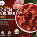 Advertisement for Tulasi Pickles' Homemade Andhra Chicken Boneless Pickle, featuring a bowl of chunky red pickle and garlic on the side.
